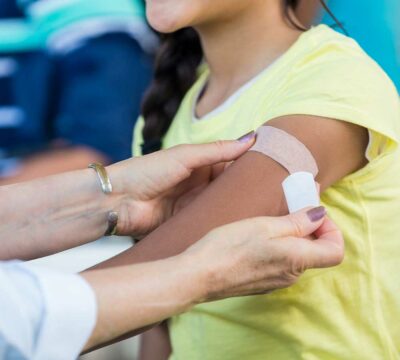 Girl getting bandage applied