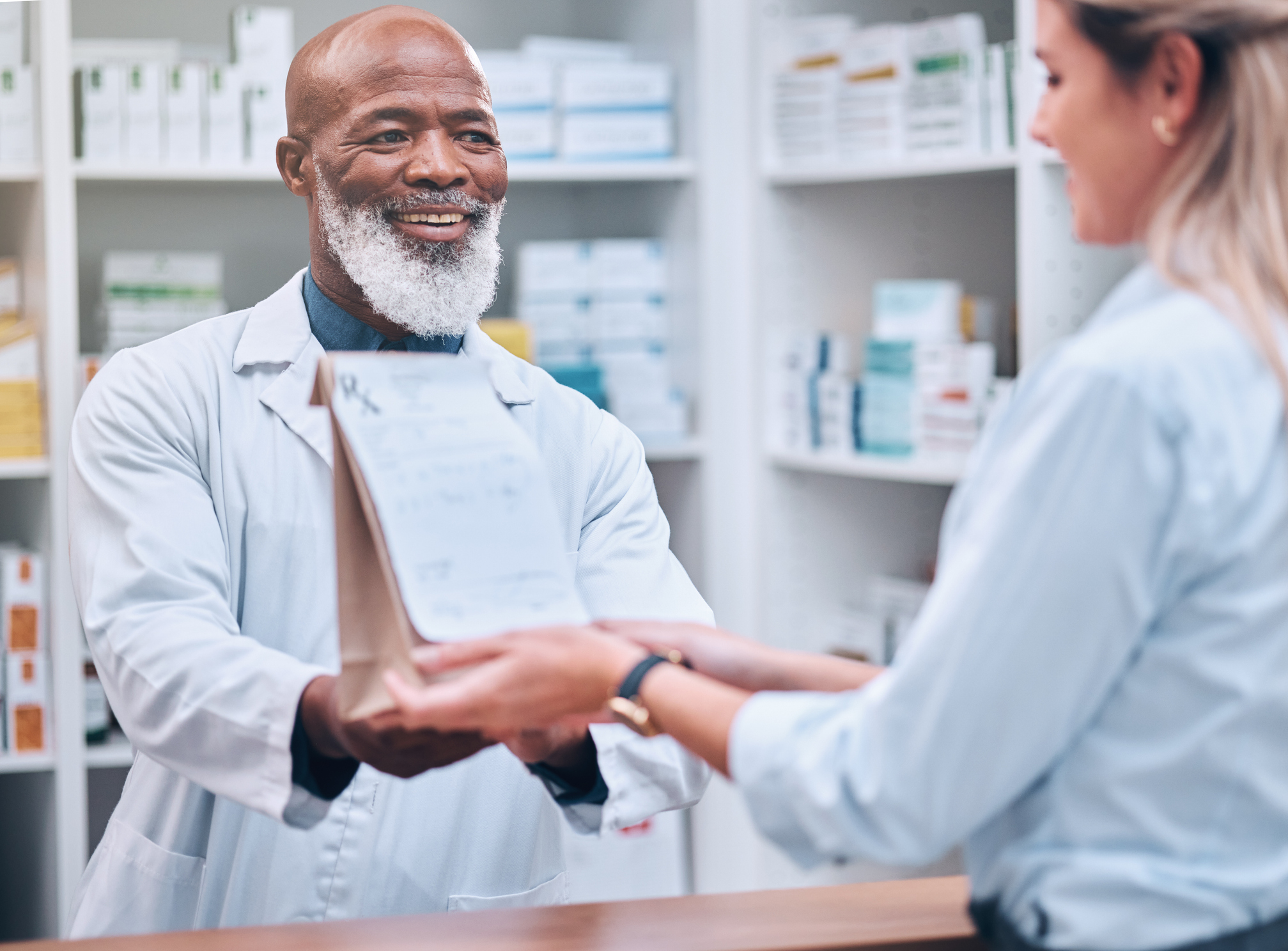 Consulting, medicine and pharmacy with black man and customer for healthcare, help or prescription. Shopping, retail and pills with pharmacist and patient for medical, wellness or medication checkout Consulting, medicine and pharmacy with black man and customer for healthcare, help or prescription. Shopping, retail and pills with pharmacist and patient for medical, wellness or medication checkout