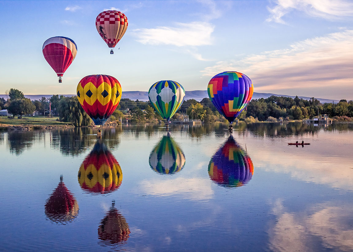 Prosser, WA, USA - September 27, 2014: The 25th Annual Great Prosser Balloon Rally. Giant balloons fly over Yakima river