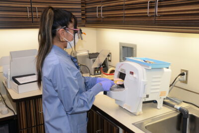 Yanina Diaz, a resident in the Northwest Dental Residency Program, trims a stone denture model at the Toppenish Medical-Dental Clinic.
