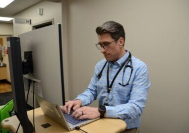 Dan Richmond, PA-C, updates an electronic chart at 11th Avenue Family Medicine Clinic. 