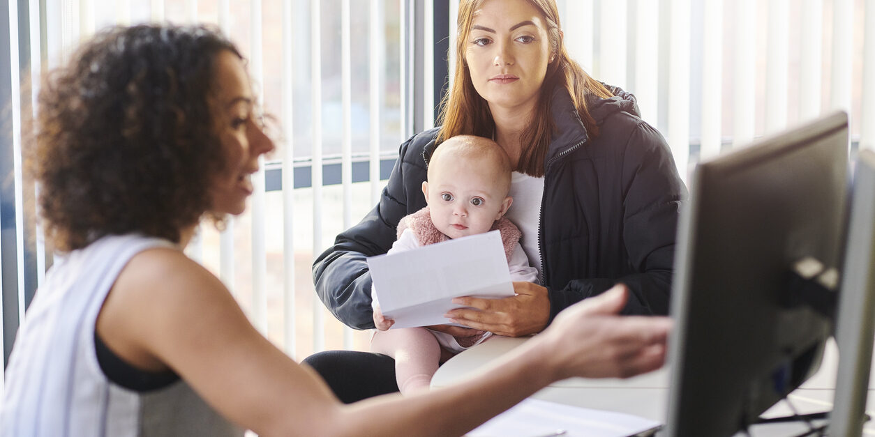 young mother with social services or housing officer