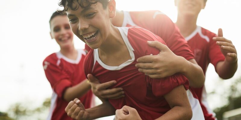 Lifestyle children training and playing soccer.