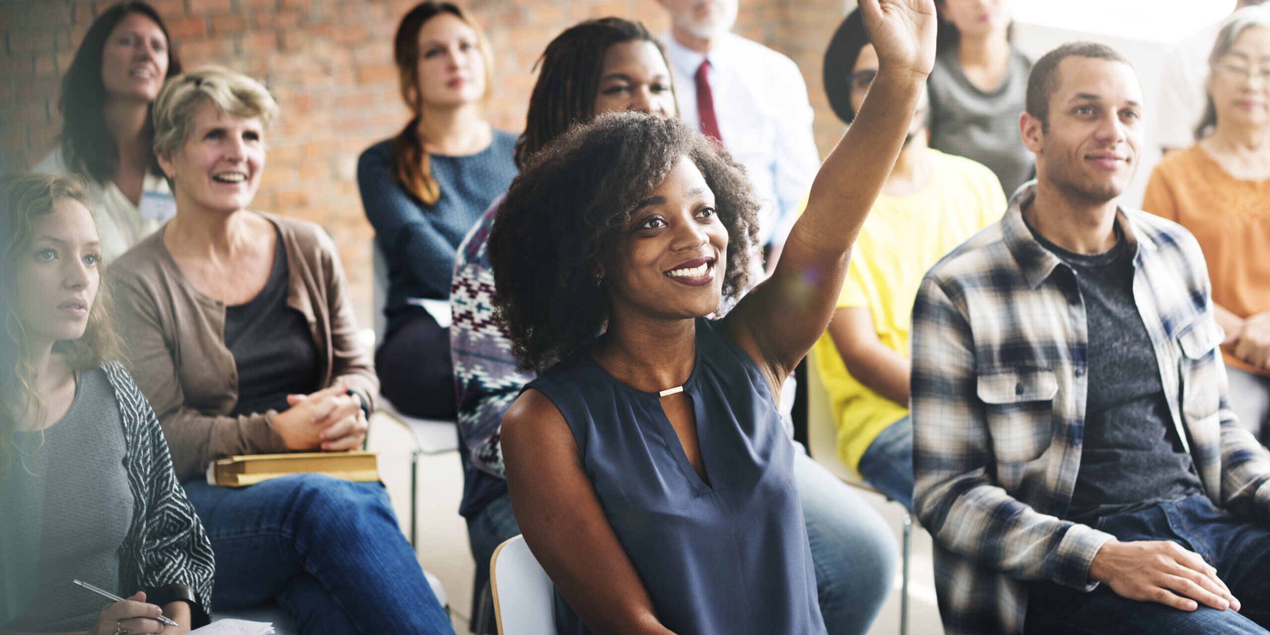 A group of diverse audience in a meeting